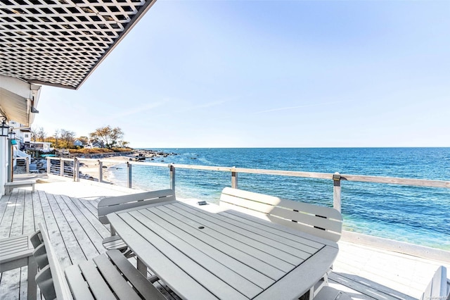 exterior space with a water view and a view of the beach