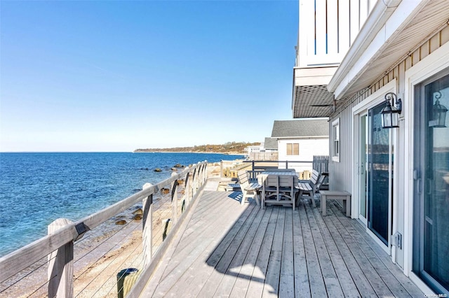 deck featuring a water view