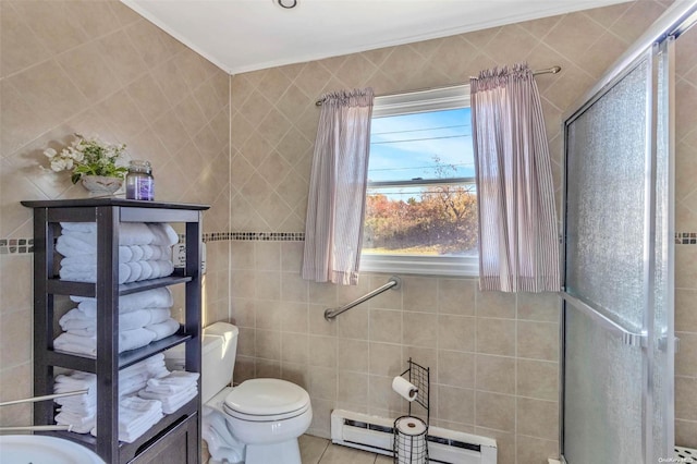 bathroom with a shower with door, tile patterned floors, toilet, tile walls, and a baseboard radiator