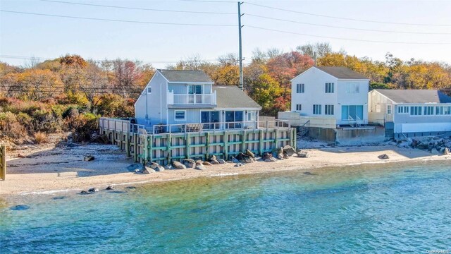 58425 Rte 48, Greenport, NY 11944 - back of property with view of water and beach and a balcony