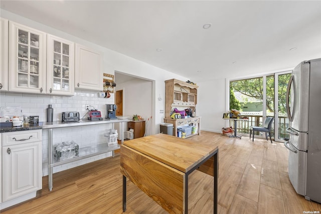 4 Maple St, Glenwood Landing, NY 11547 - kitchen featuring freestanding refrigerator, white cabinets, light wood-type flooring, and glass insert cabinets