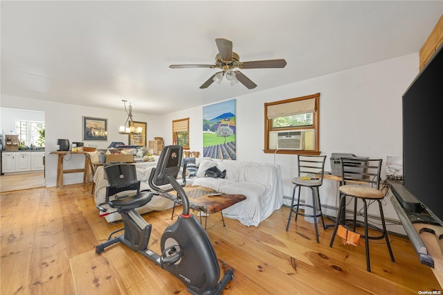 4 Maple St, Glenwood Landing, NY 11547 - workout room featuring ceiling fan, cooling unit, light wood-type flooring, and a chandelier