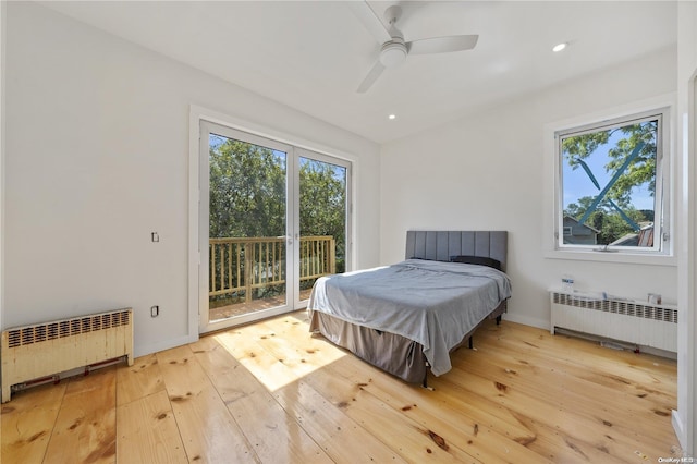 4 Maple St, Glenwood Landing, NY 11547 - bedroom with radiator heating unit, access to outside, multiple windows, and recessed lighting