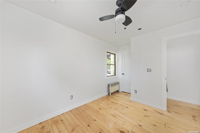 4 Maple St, Glenwood Landing, NY 11547 - spare room with radiator heating unit, hardwood / wood-style floors, baseboards, and a ceiling fan