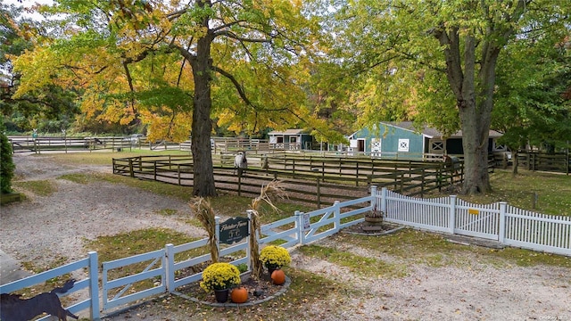 view of yard with a rural view