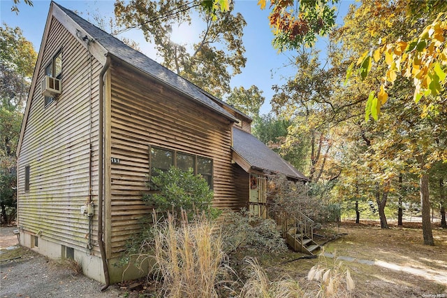 view of side of property featuring cooling unit