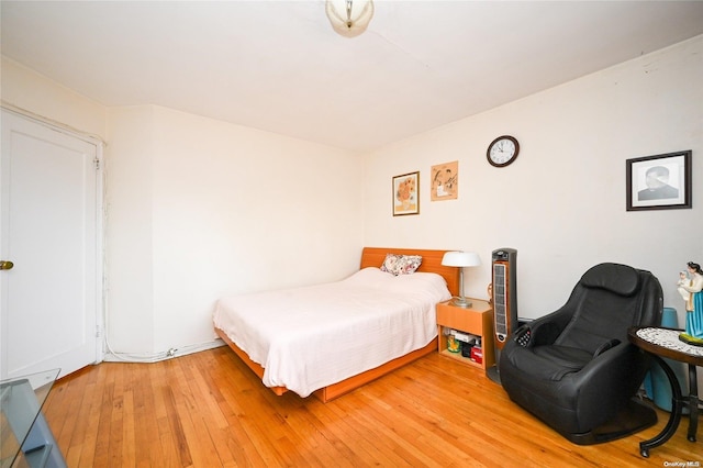 bedroom with hardwood / wood-style flooring