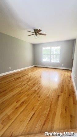 unfurnished room with ceiling fan and light hardwood / wood-style floors