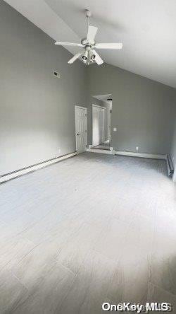 empty room featuring ceiling fan and lofted ceiling