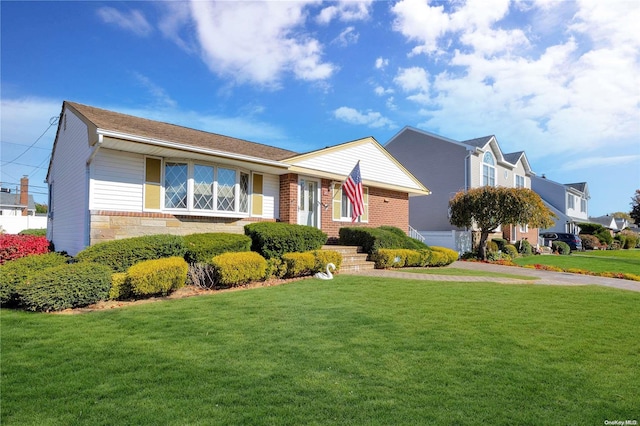 ranch-style house featuring a front lawn