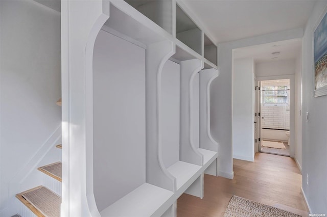 mudroom with light hardwood / wood-style flooring