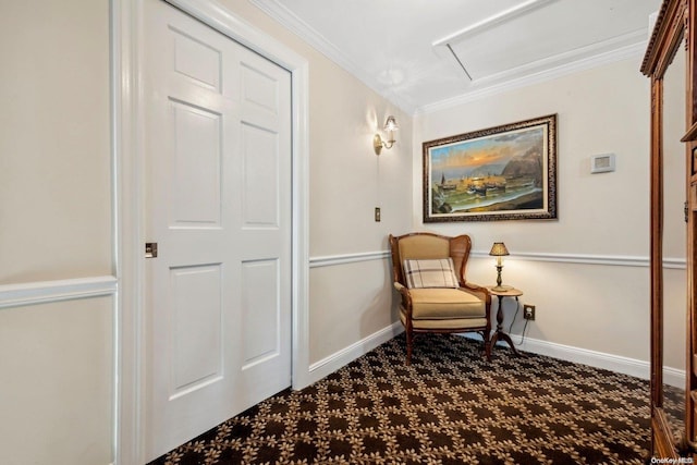 sitting room featuring carpet and crown molding