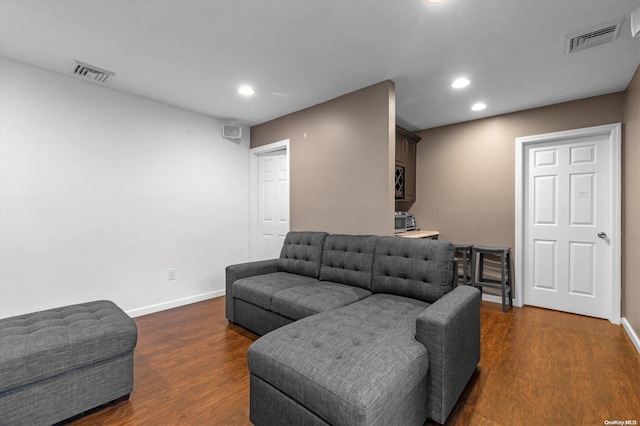 living room featuring dark wood-type flooring