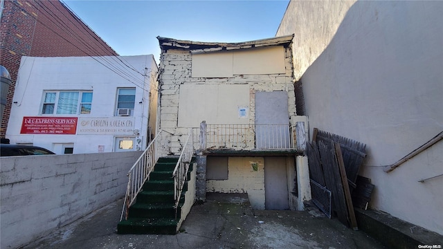 view of side of property with cooling unit