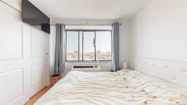 bedroom with light hardwood / wood-style flooring