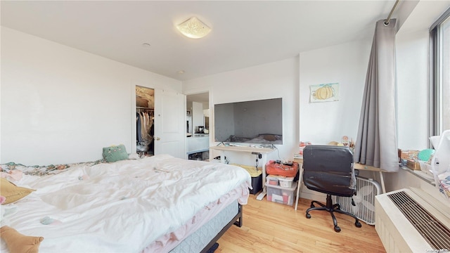 bedroom with light wood-type flooring