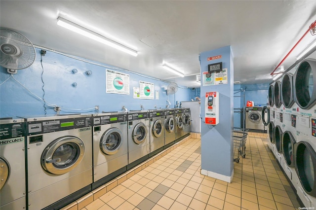 laundry area featuring separate washer and dryer and light tile patterned floors