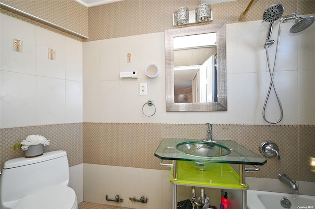 full bathroom with tiled shower / bath combo, vanity, and toilet