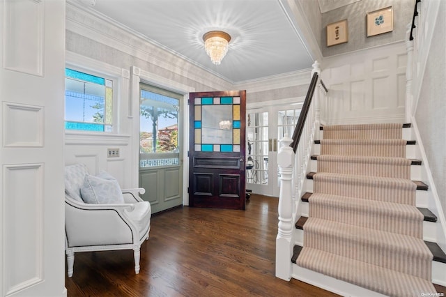 entryway featuring ornamental molding and dark wood-type flooring