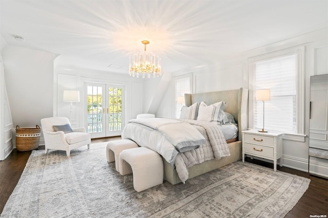 bedroom with a chandelier, french doors, dark hardwood / wood-style flooring, and access to outside