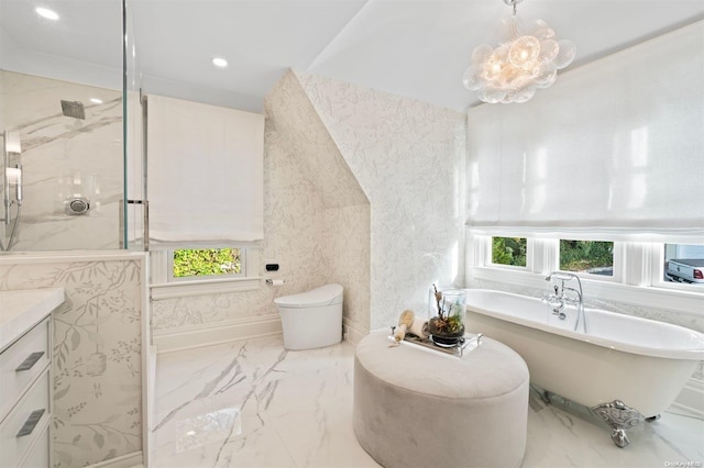 full bathroom featuring toilet, vanity, an inviting chandelier, and separate shower and tub