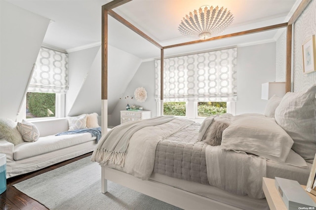 bedroom featuring multiple windows, crown molding, and hardwood / wood-style floors