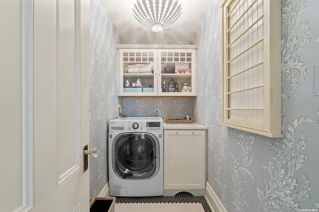 laundry area with cabinets, tile patterned flooring, and washer / dryer