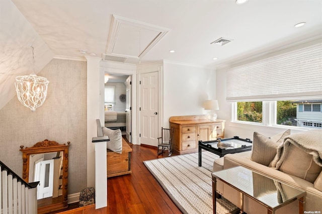 living area featuring crown molding and dark wood-type flooring