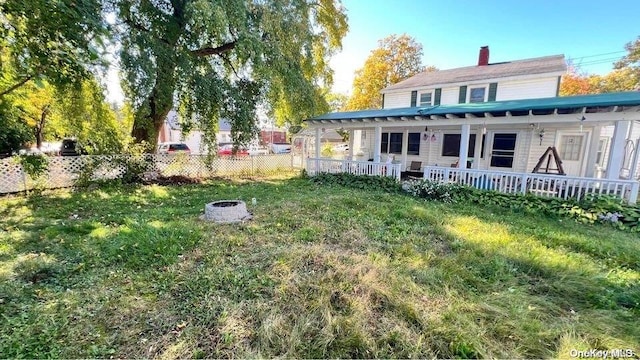 view of yard with a fire pit