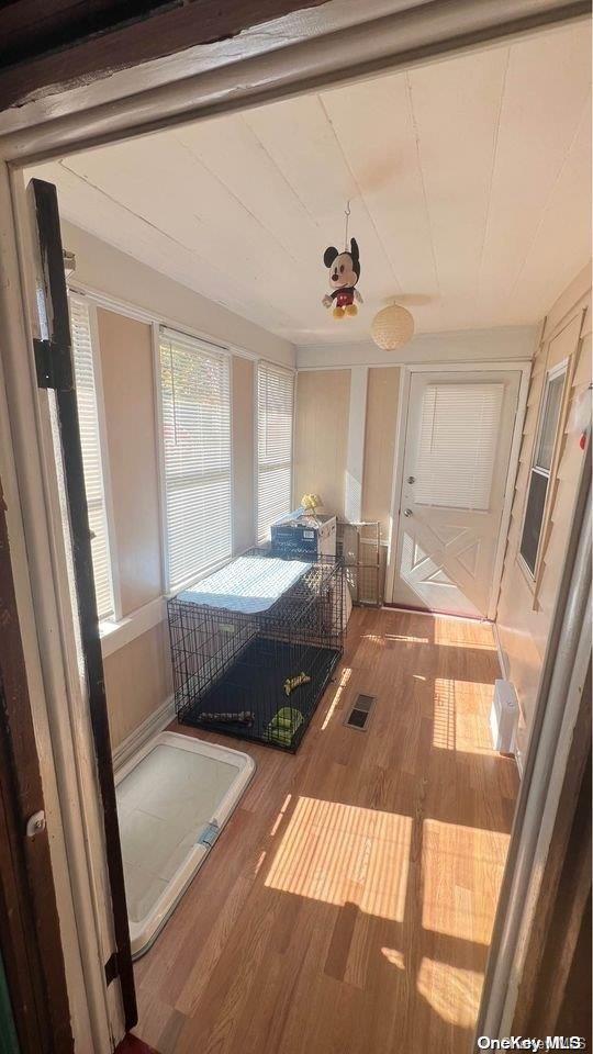 bedroom with hardwood / wood-style flooring