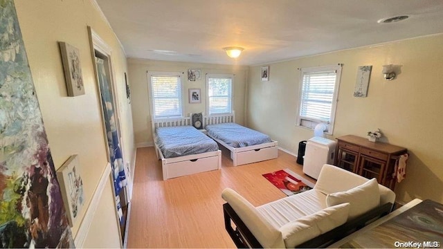 bedroom with hardwood / wood-style floors