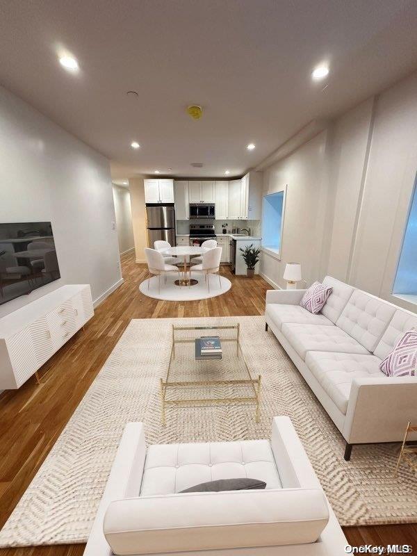 living room with light hardwood / wood-style flooring