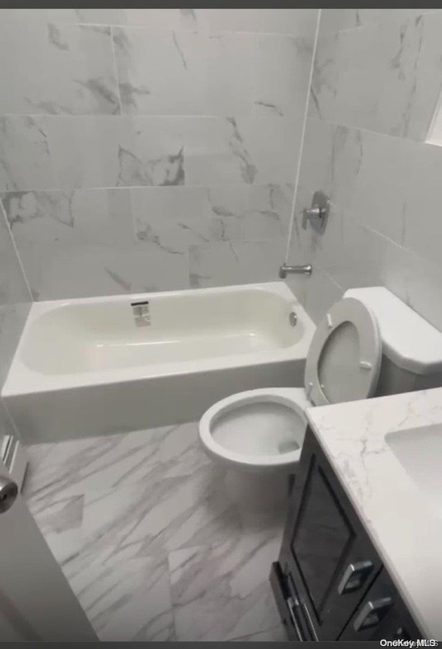 full bathroom with vanity, shower / bathtub combination, and toilet