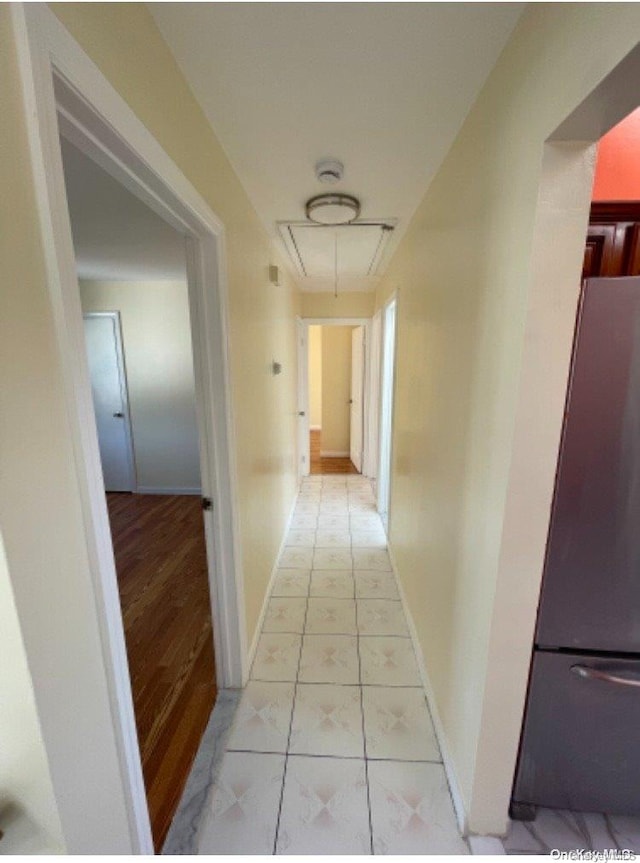 corridor featuring light hardwood / wood-style floors