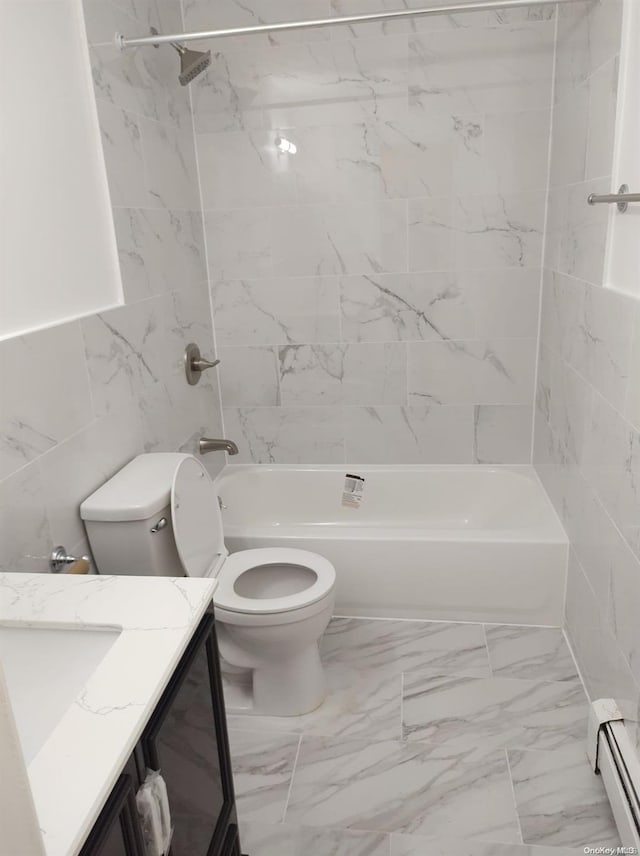 full bathroom with a baseboard heating unit, toilet, vanity, tile walls, and tiled shower / bath