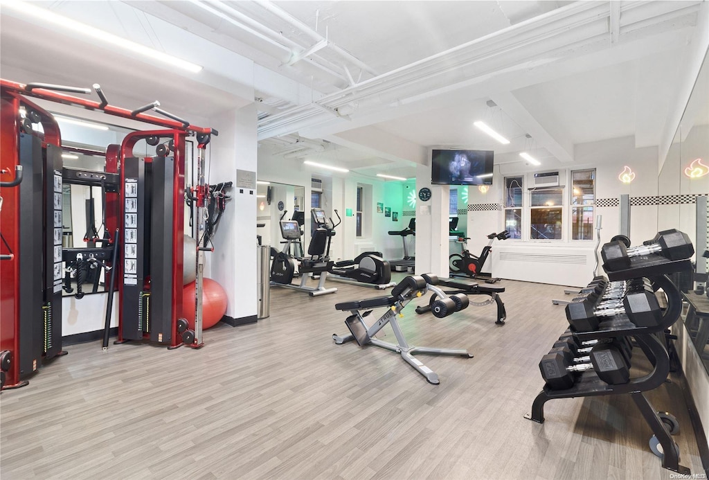 gym with light hardwood / wood-style floors