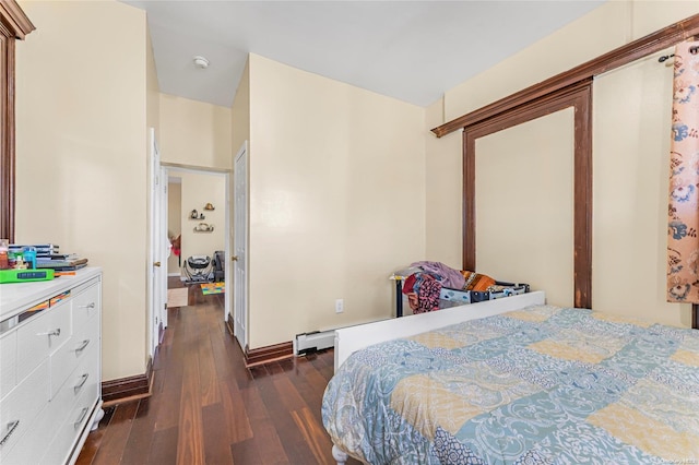 bedroom featuring dark hardwood / wood-style floors and baseboard heating