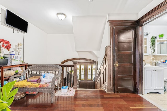 entryway with dark hardwood / wood-style flooring