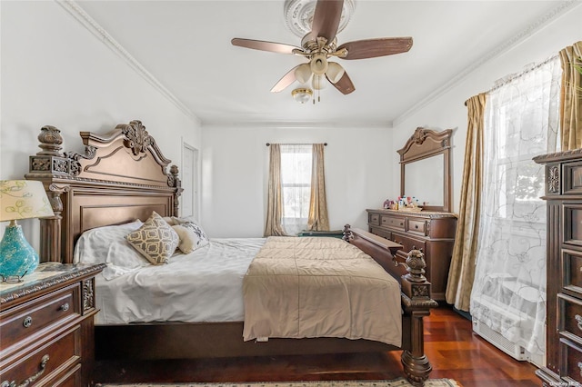 bedroom featuring crown molding, ceiling fan, and dark wood-type flooring