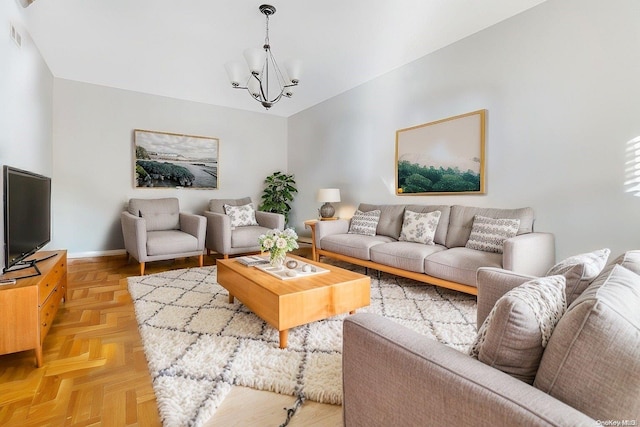 living room featuring an inviting chandelier and light parquet flooring