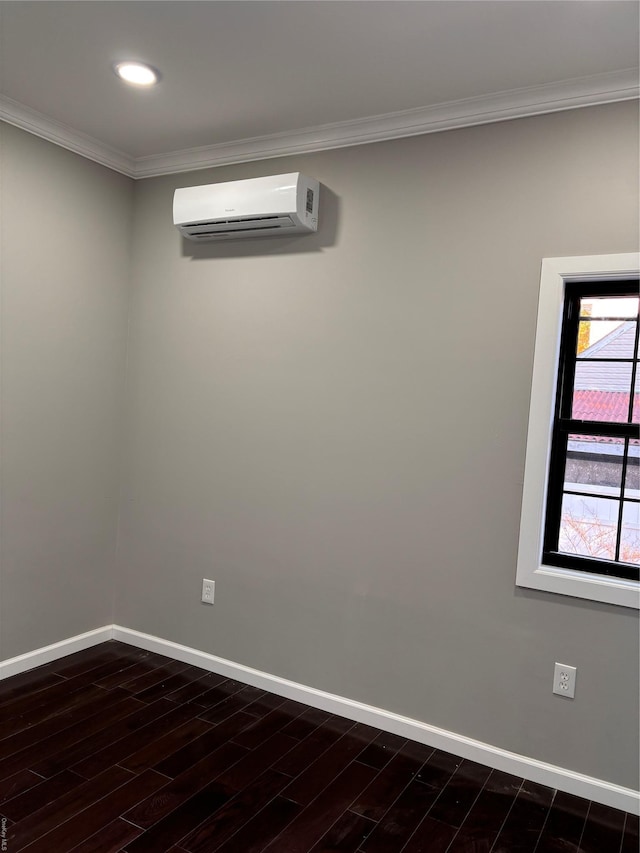 empty room with an AC wall unit, ornamental molding, and dark wood-type flooring