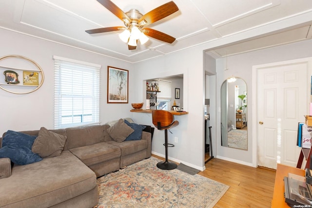 living room with ceiling fan and light hardwood / wood-style flooring