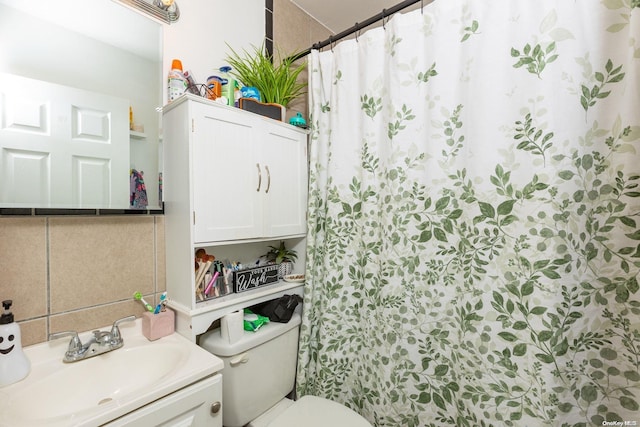 bathroom featuring vanity, toilet, and walk in shower