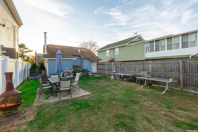 view of yard featuring a patio area and an outdoor fire pit