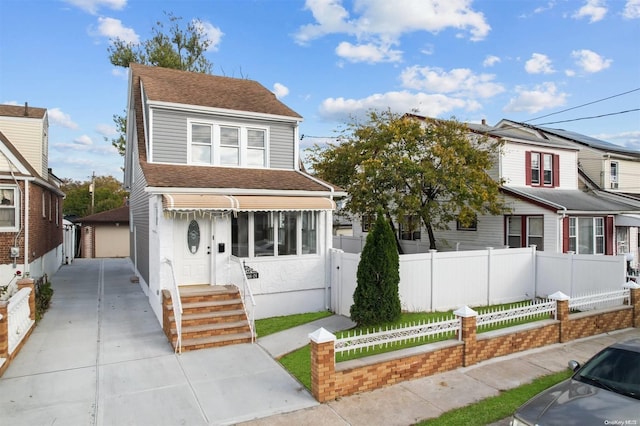 view of front of house featuring a garage and an outdoor structure