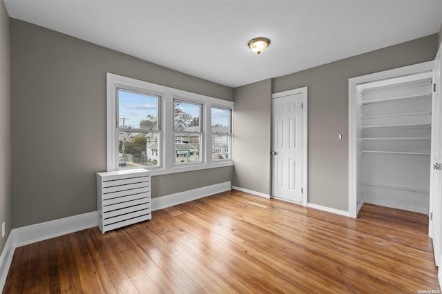 unfurnished bedroom featuring hardwood / wood-style floors