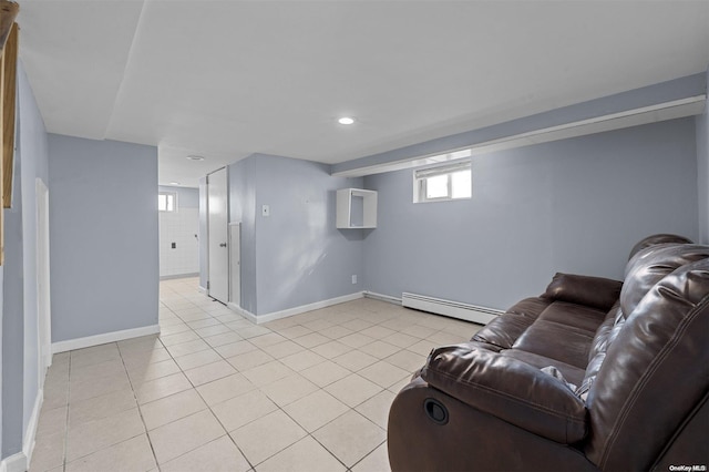 living room featuring light tile patterned floors and a baseboard radiator