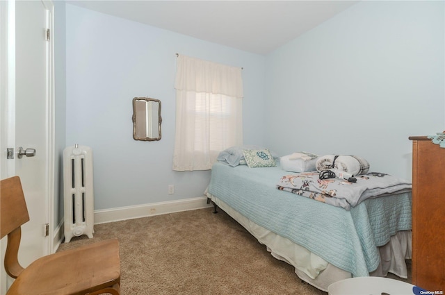 bedroom featuring carpet flooring and radiator heating unit