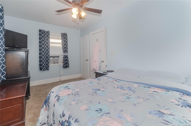 carpeted bedroom with ceiling fan and cooling unit