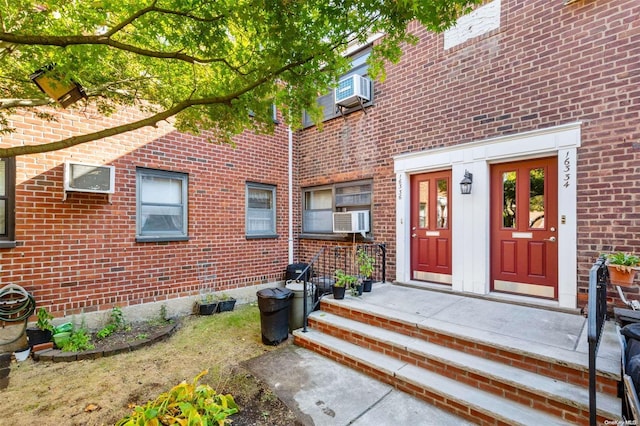 entrance to property featuring cooling unit